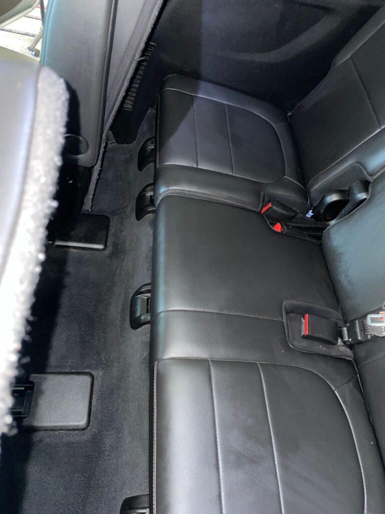 A photo of a spotless dashboard, seats, or interior trim that looks polished and fresh.